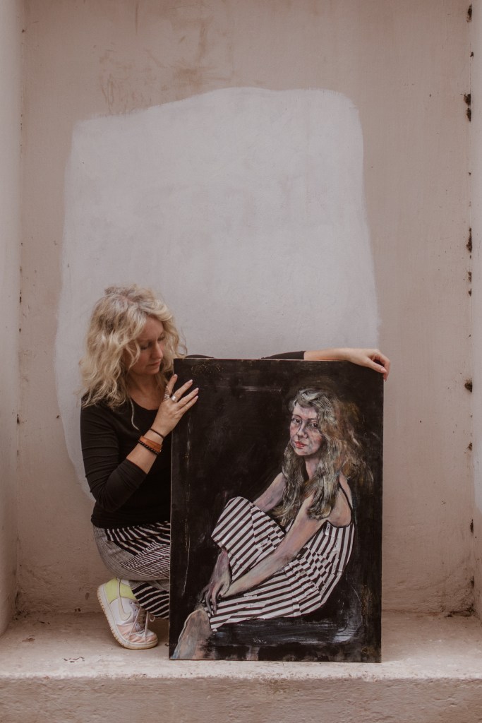 Cherie with her Artwork. 